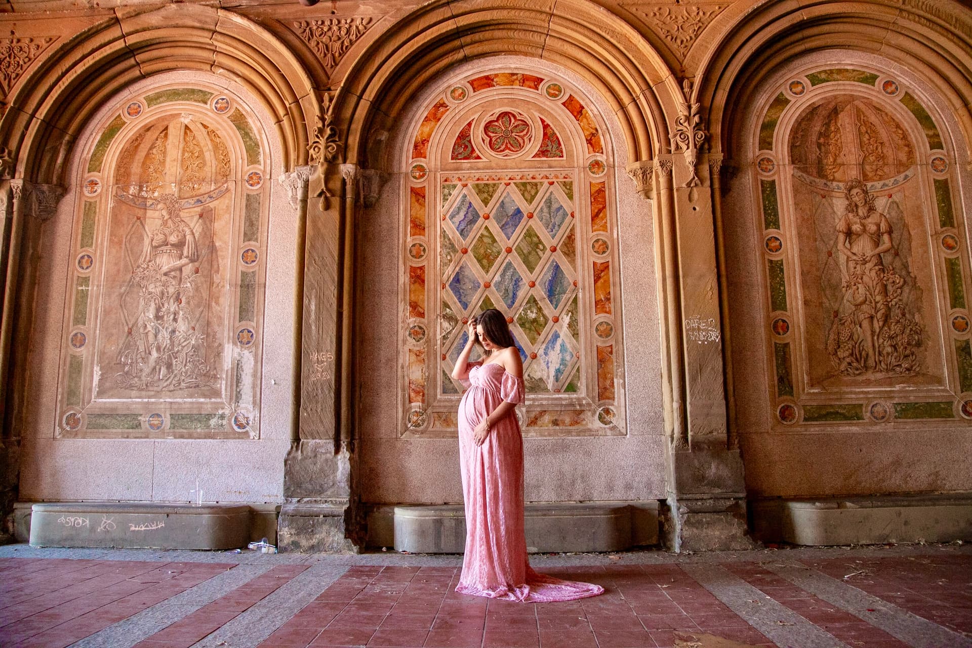 Expecting mother posing in an architectural interior
