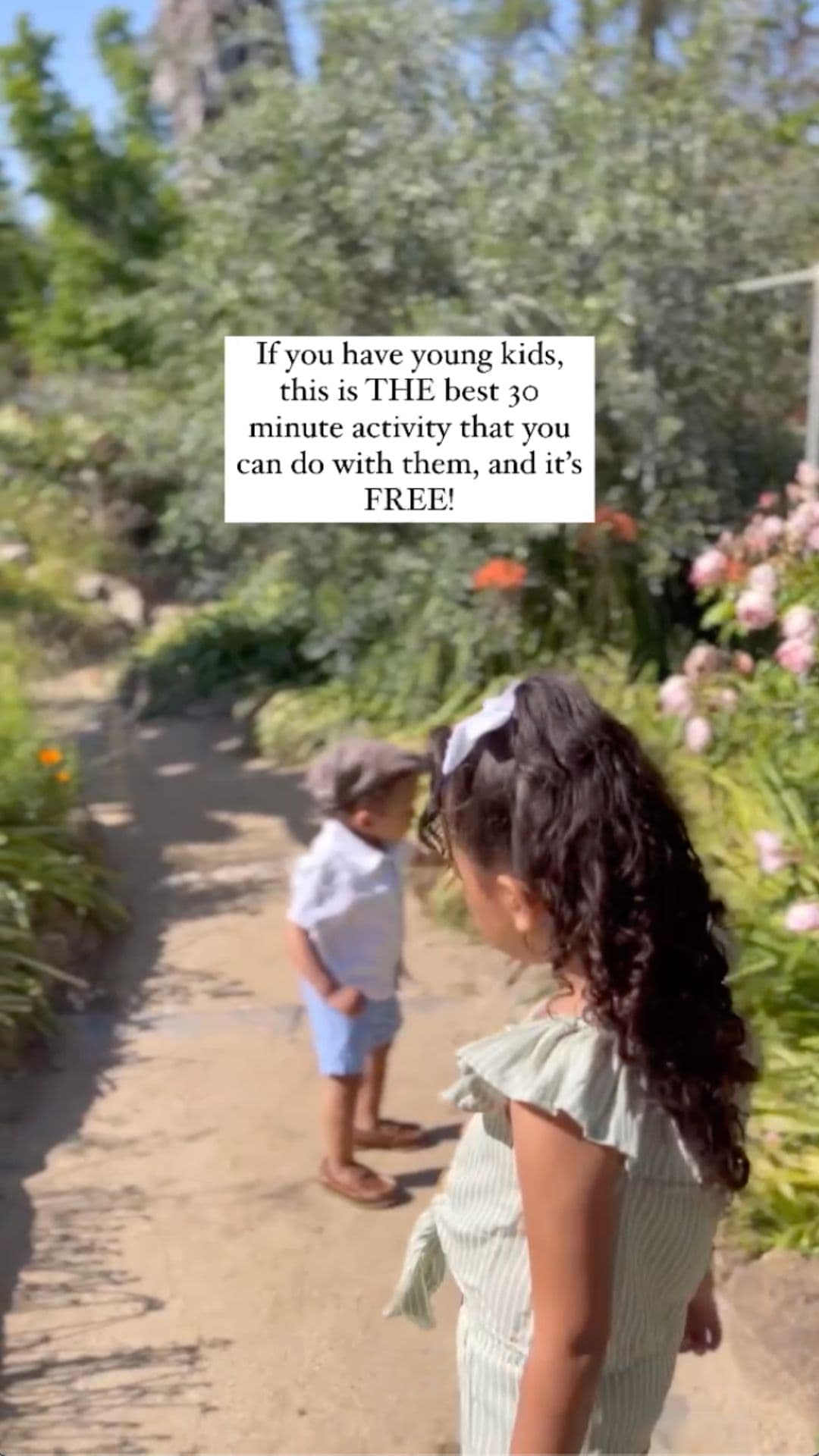 Two young children exploring a garden path with text overlay recommending a free activity for kids.