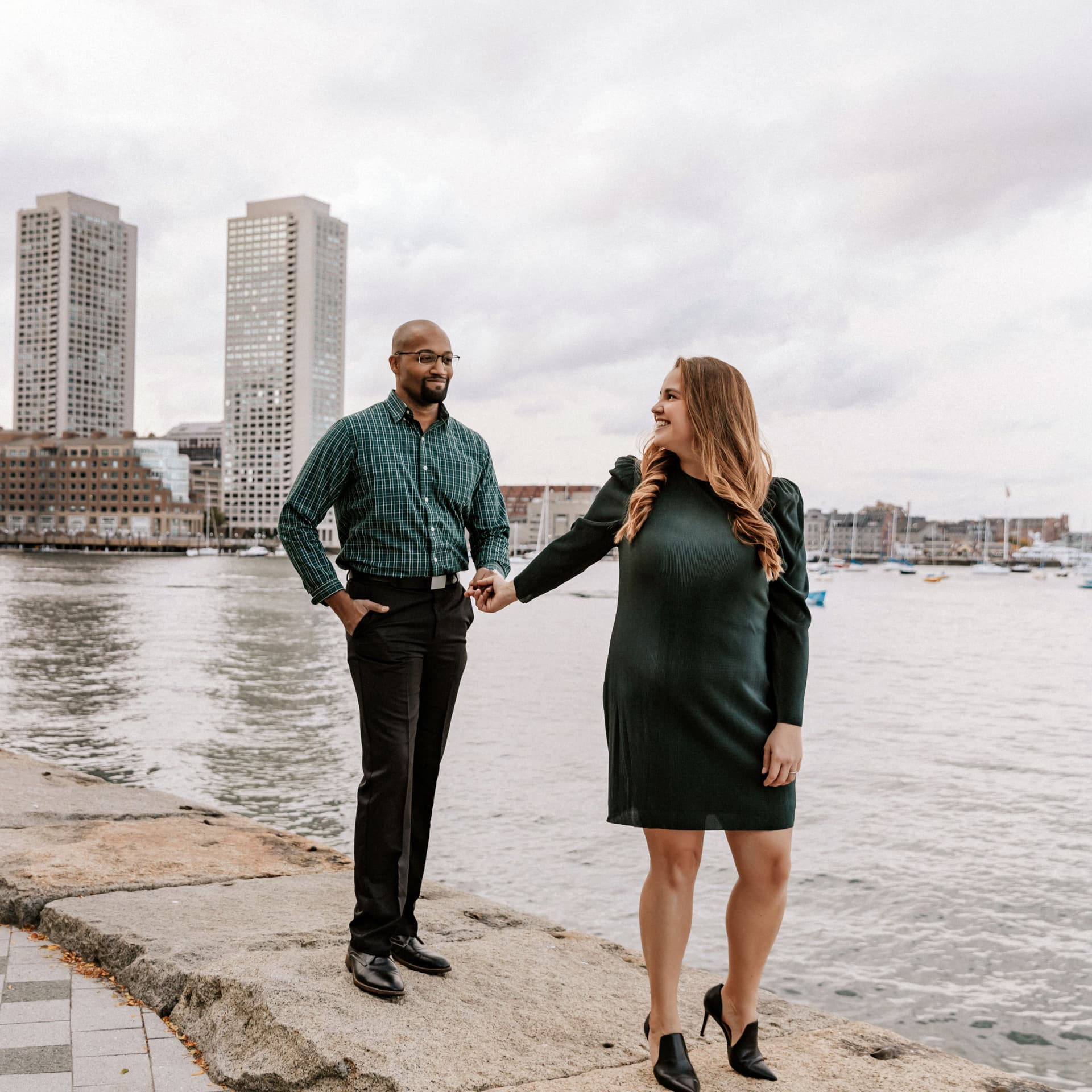 Couple poses outdoors for their free city pier photoshoot