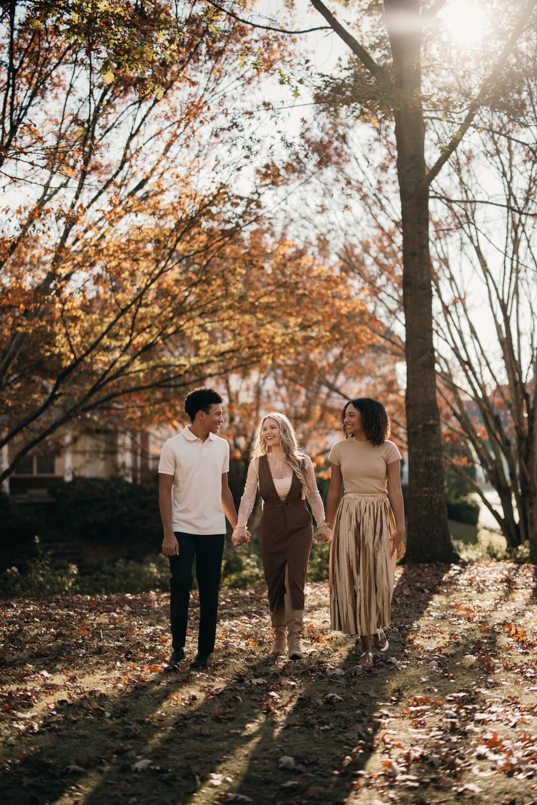 Family wearing coordinated outfits for outdoor Shoott family photos during golden hour.