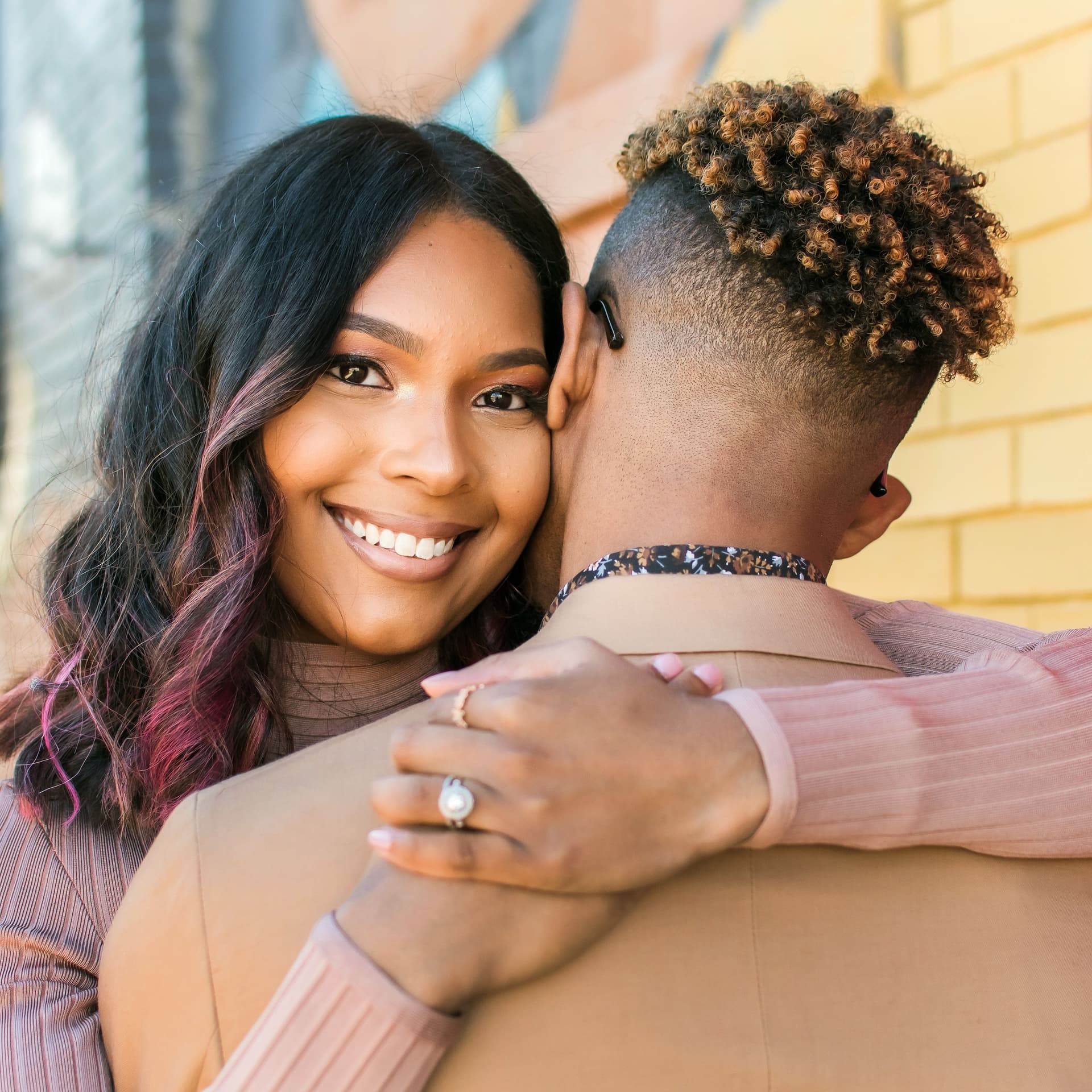 Couple hugs for their free outdoor engagement photoshoot
